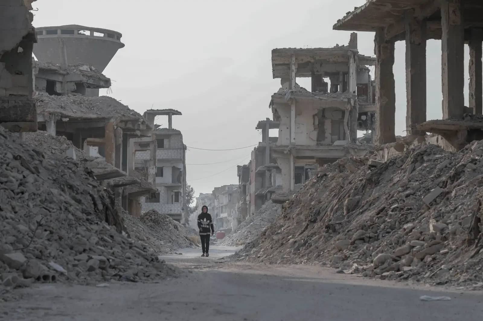 War-torn street with damaged buildings