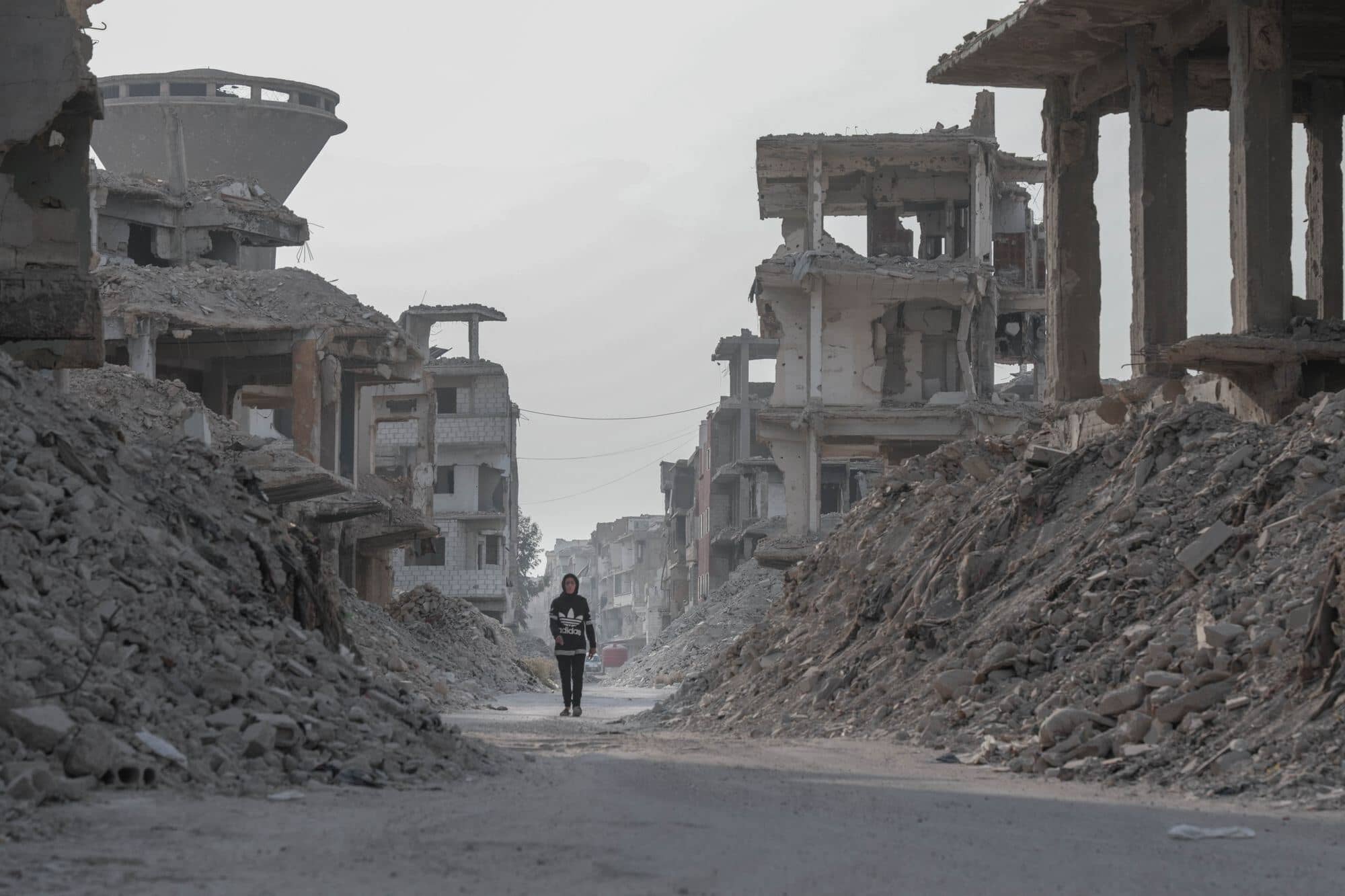 War-torn street with damaged buildings